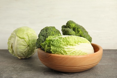 Photo of Plate with different cabbages on table. Healthy food