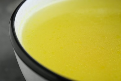 Photo of Bowl of delicious chicken bouillon, closeup view