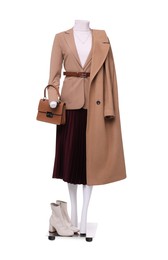 Photo of Female mannequin dressed in jacket, turtleneck, skirt and trench coat with accessories isolated on white. Stylish outfit