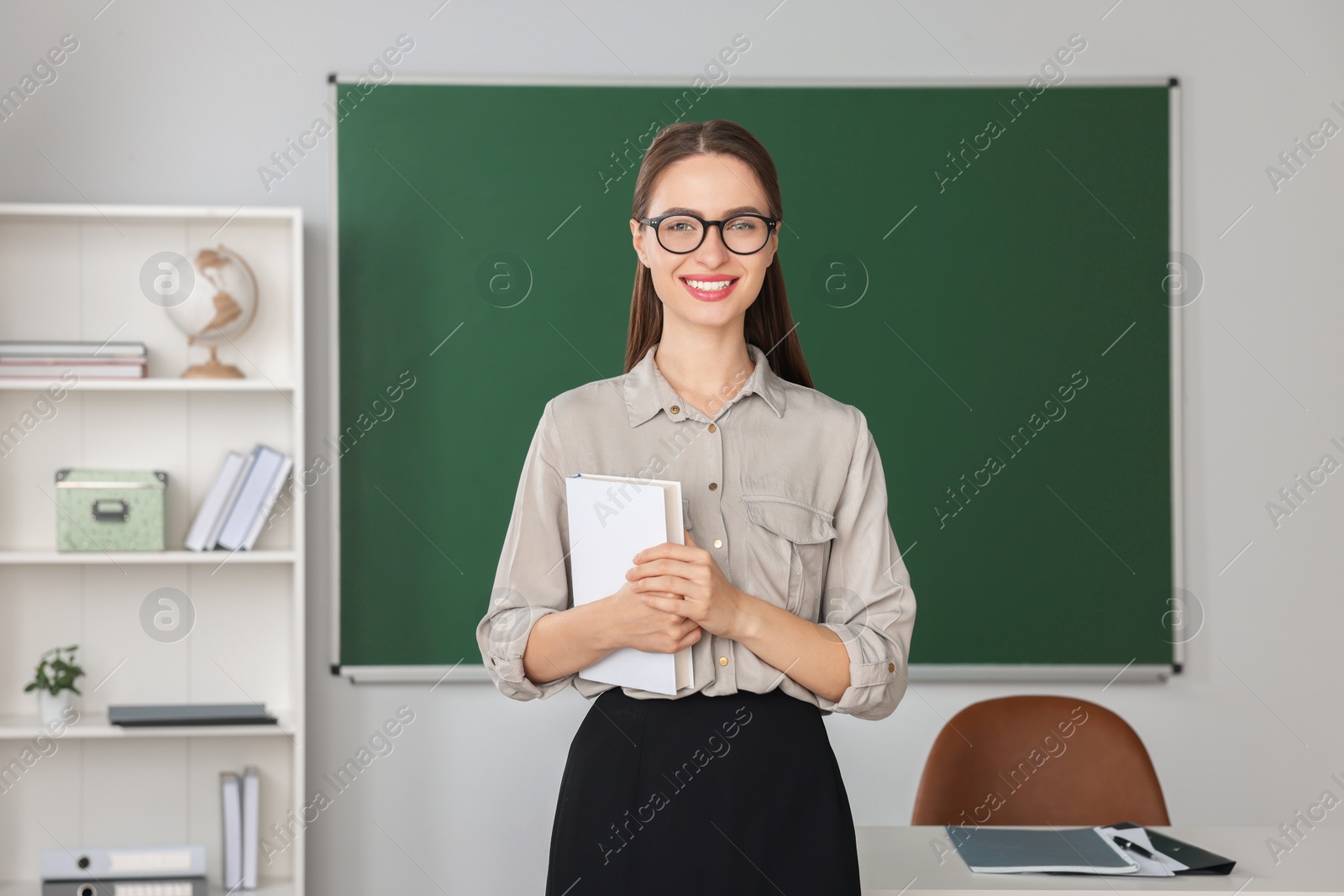 Photo of Portrait of beautiful young teacher in classroom