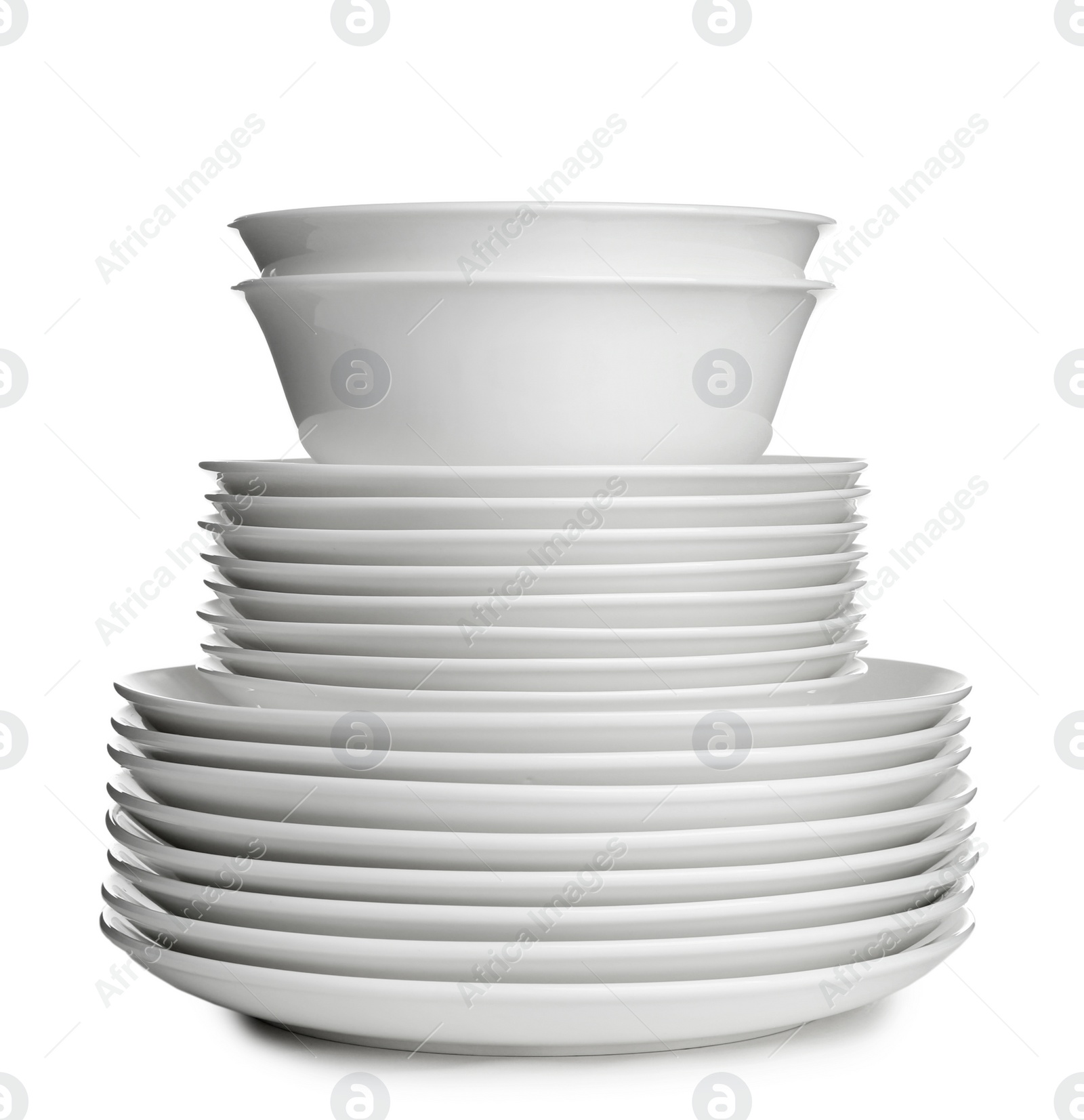 Photo of Stack of ceramic dishware on white background