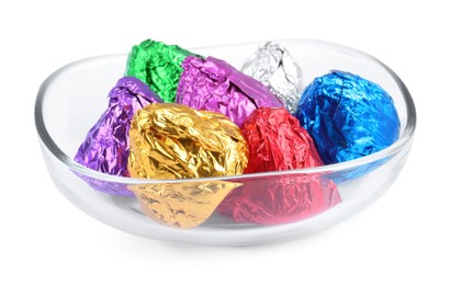 Bowl with many tasty candies in colorful wrappers isolated on white