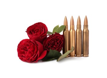 Photo of Bullets and beautiful rose flowers isolated on white