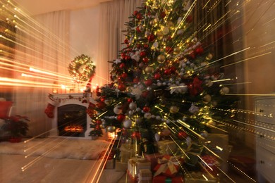 Photo of Festive living room interior with Christmas tree and fireplace, long exposure effect