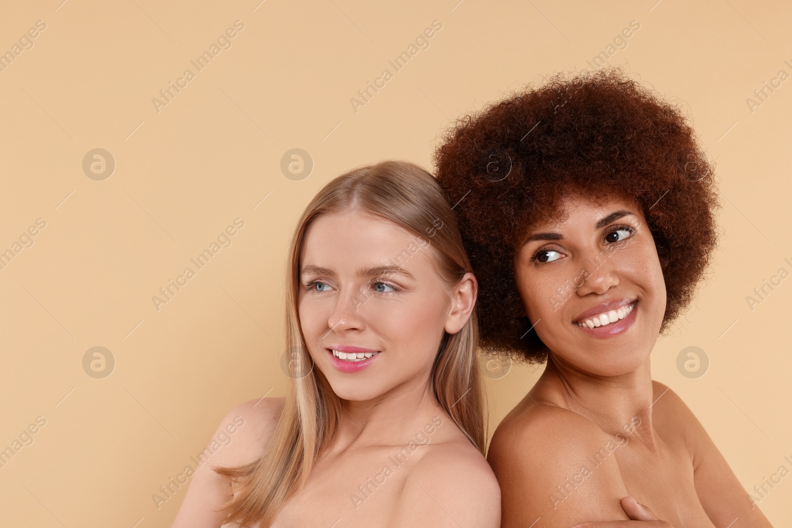 Photo of Portrait of beautiful young women on beige background. Space for text