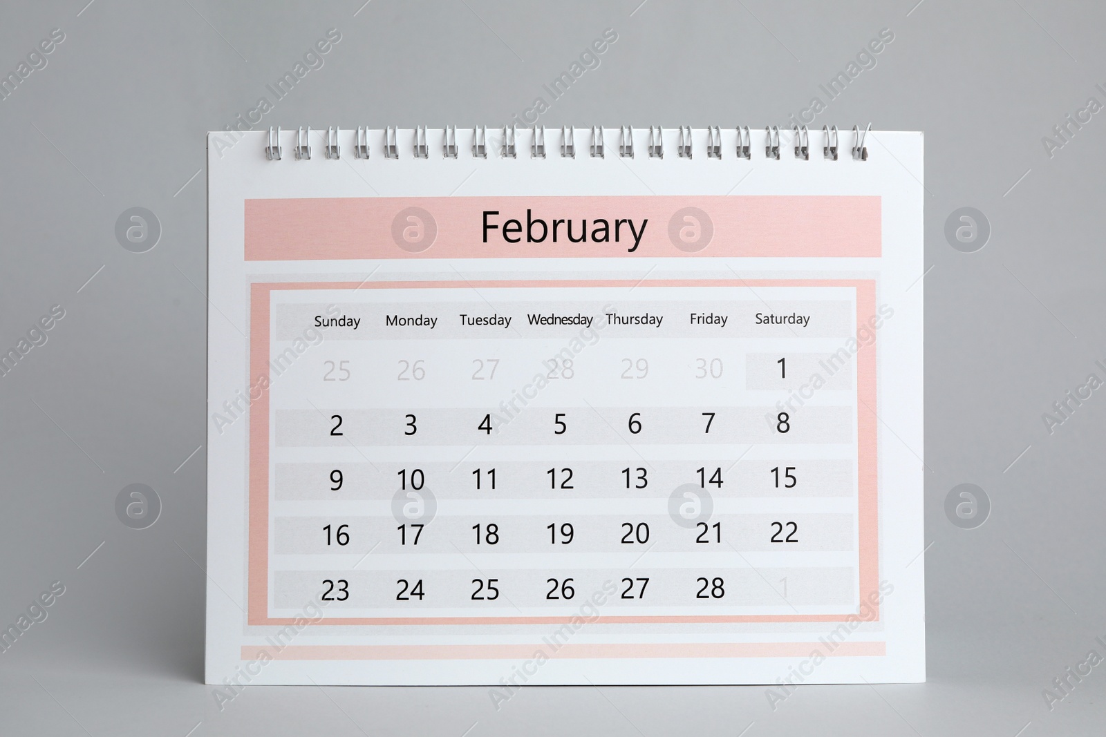 Photo of Paper calendar on grey background. Planning concept