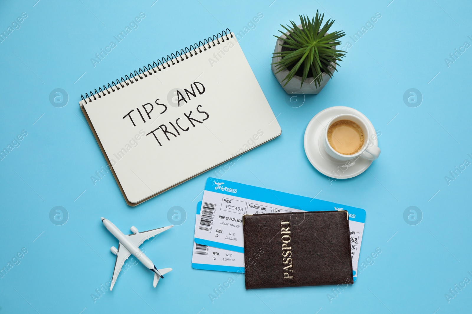 Photo of Flat lay composition with notebook on light blue background. Tips and Tricks