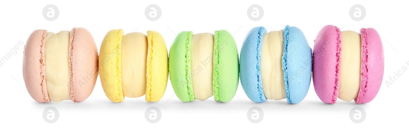 Photo of Many delicious colorful macarons on white background