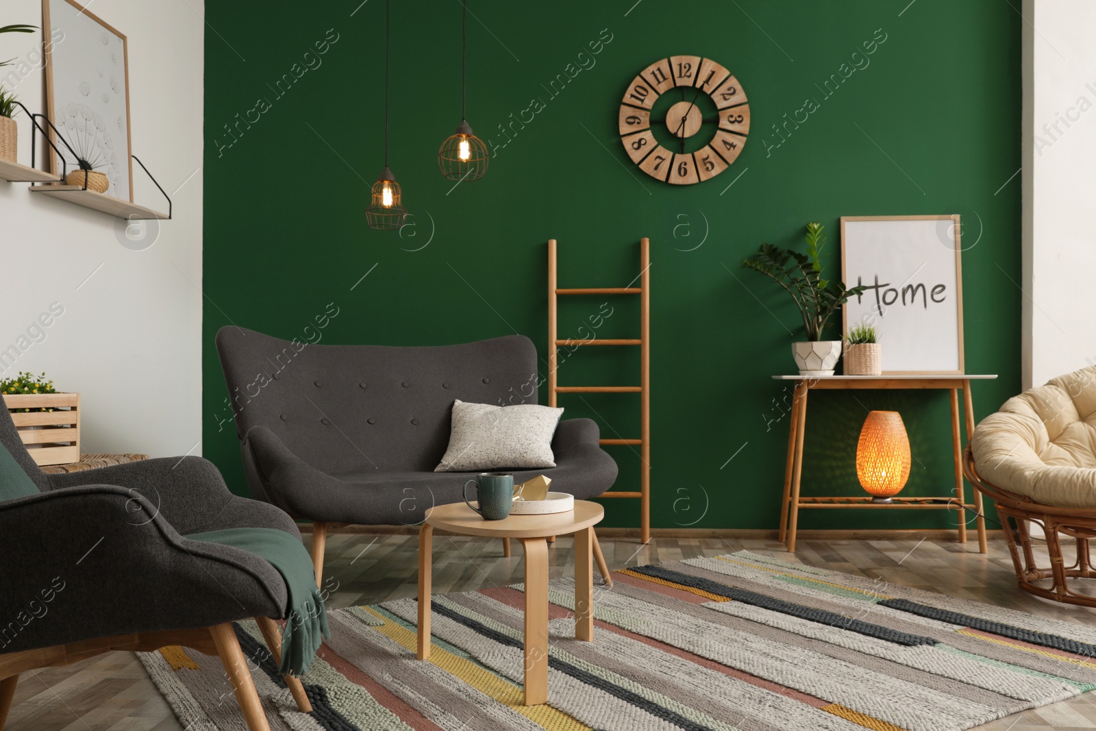 Photo of Modern living room interior stylish sofa near green wall