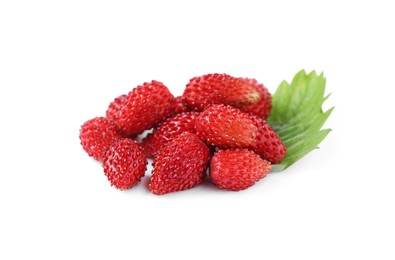 Photo of Ripe wild strawberries and green leaf on white background