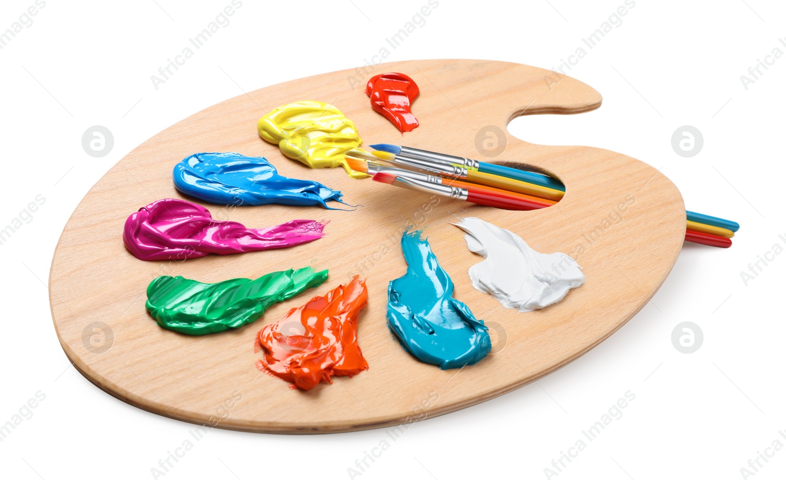 Photo of Palette with paints and brushes on white background. Artist equipment