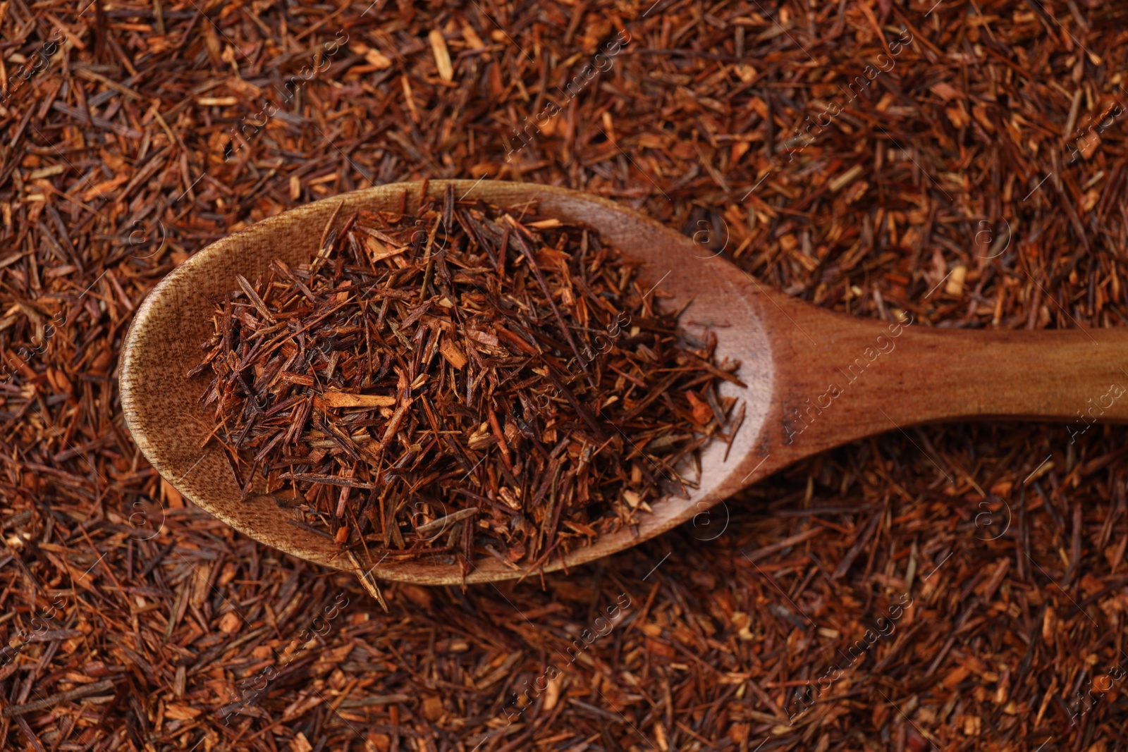 Photo of Rooibos tea and wooden spoon, top view