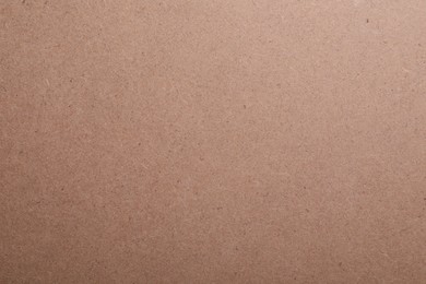 Photo of Texture of kraft paper bag as background, closeup