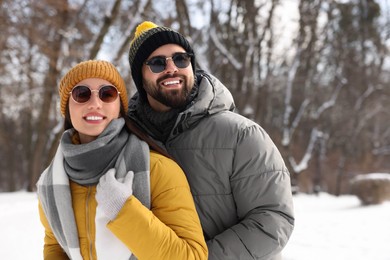 Beautiful happy couple spending time together on winter day