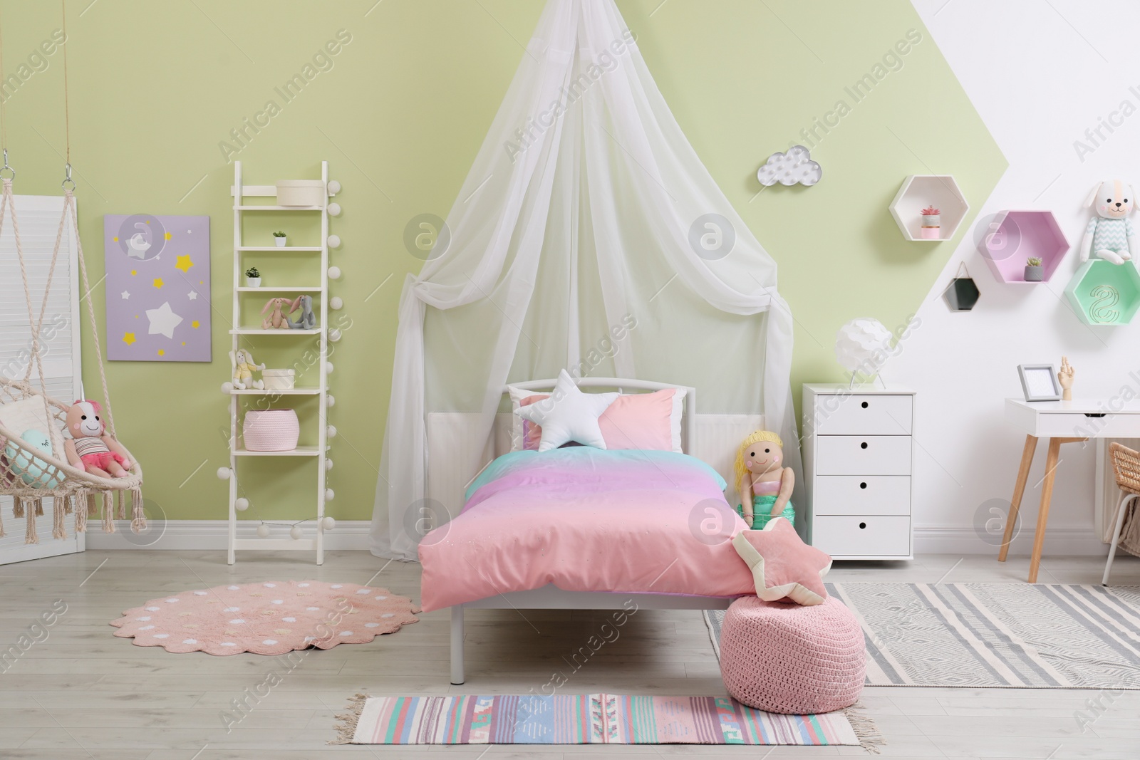 Photo of Cute child's room interior with toys and modern furniture