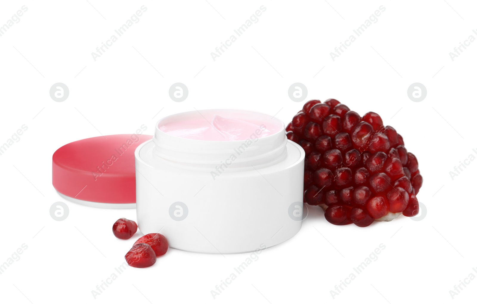 Photo of Jar with natural facial mask and pomegranate seeds isolated on white