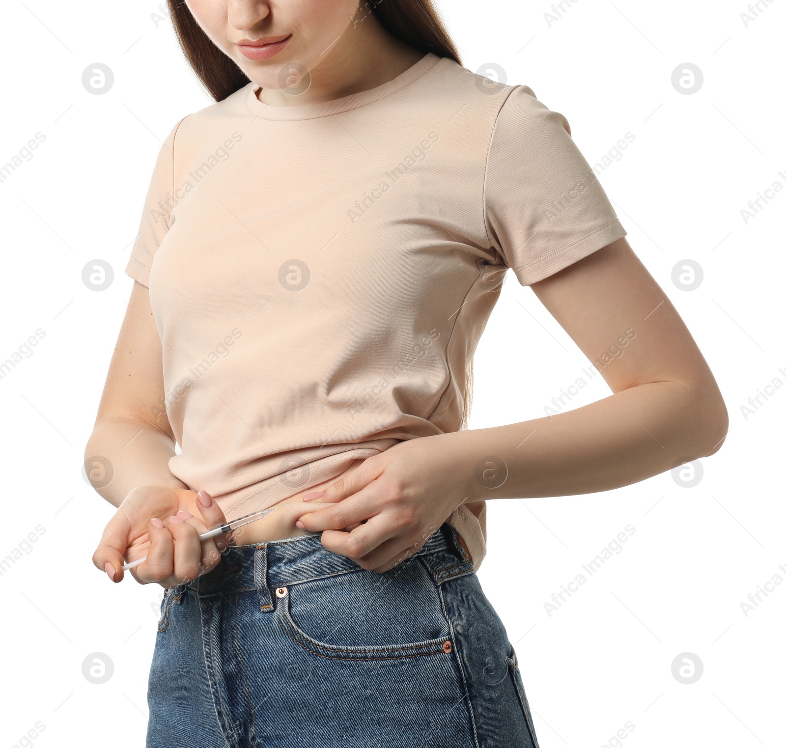 Photo of Diabetes. Woman making insulin injection into her belly on white background, closeup