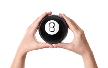 Woman holding magic eight ball on white background, closeup