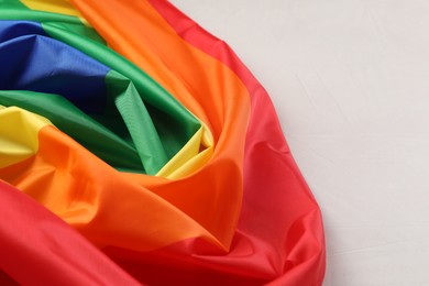 Photo of Rainbow LGBT flag on white background, closeup