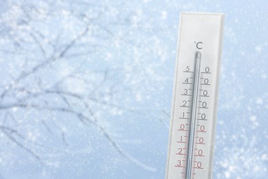 Image of Thermometer showing temperature below zero outdoors on winter day