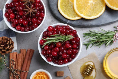 Flat lay composition with fresh ripe cranberries on grey table