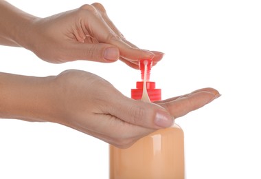 Photo of Woman using liquid soap dispenser on white background, closeup