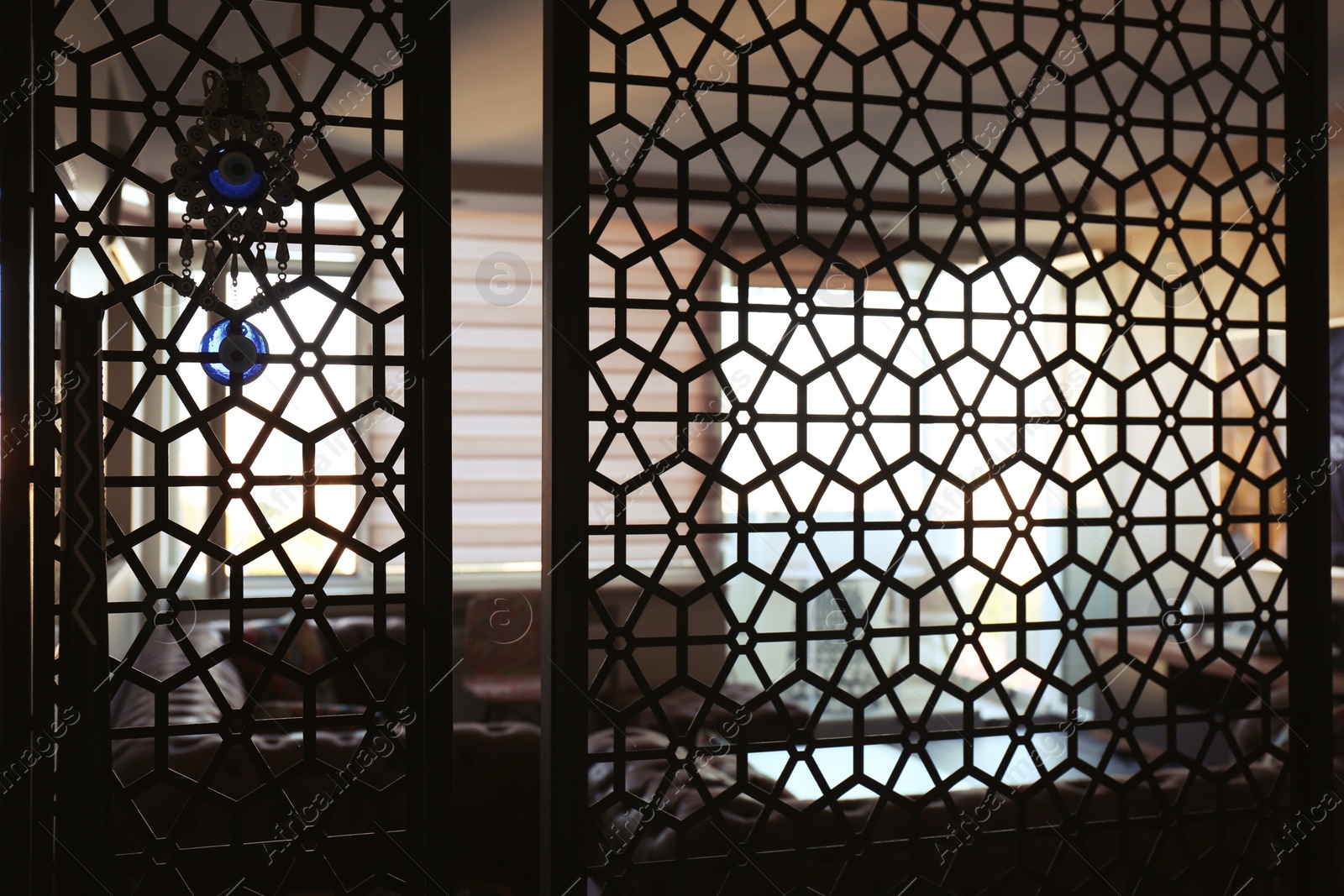 Photo of Interior of living room, view through decorative room divider