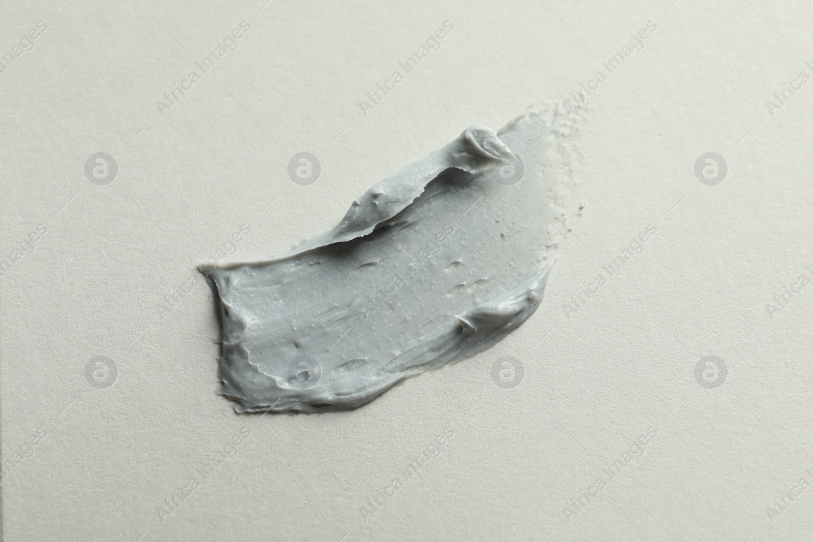 Photo of Sample of face mask on light background, top view