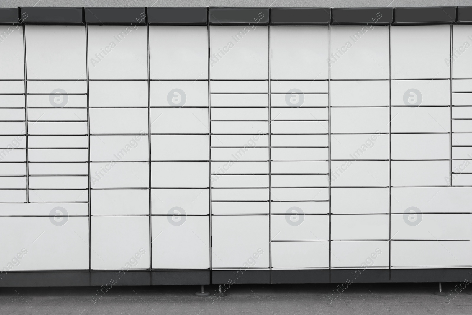 Photo of Modern parcel locker with many postal boxes
