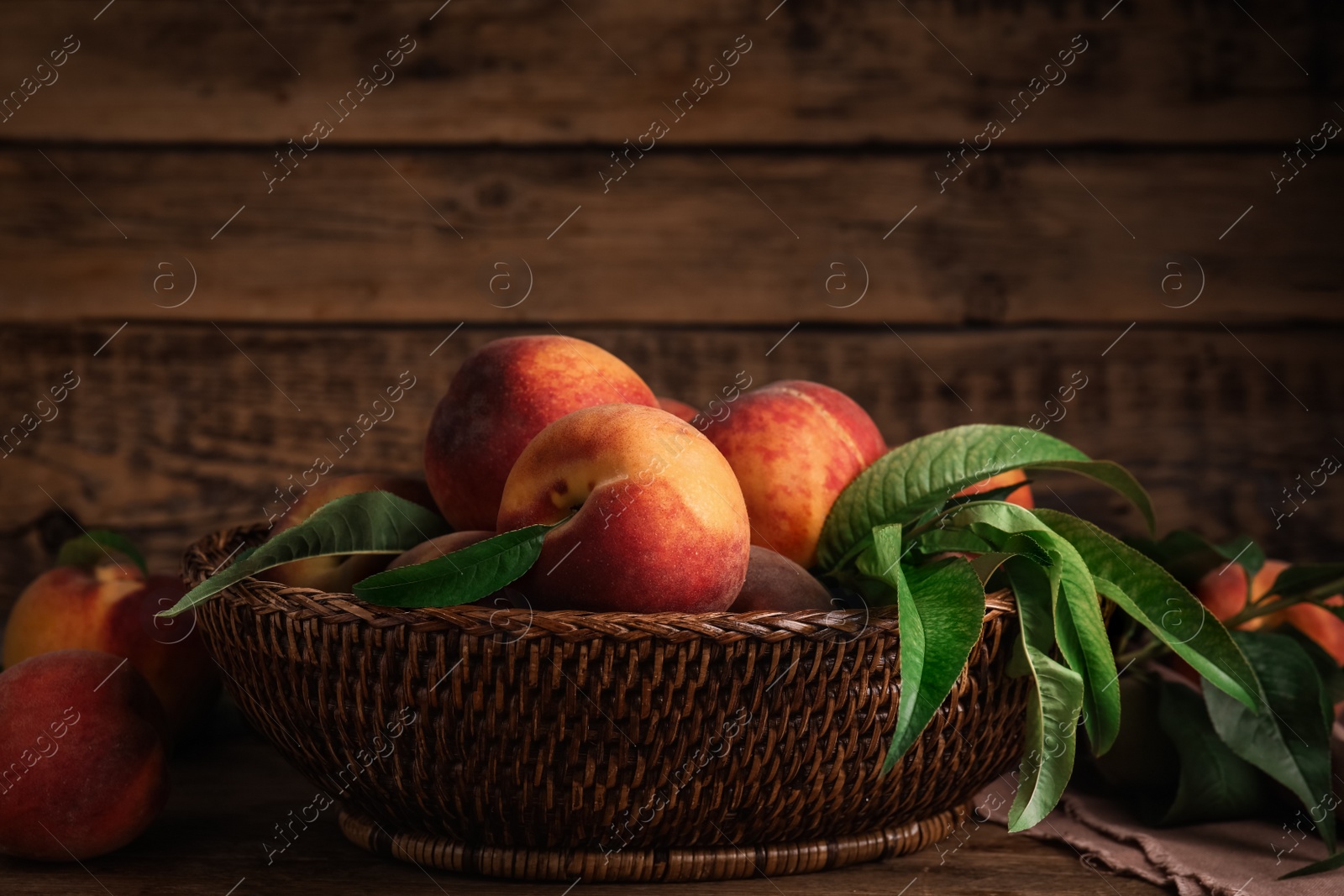 Photo of Fresh ripe juicy peaches on wooden table