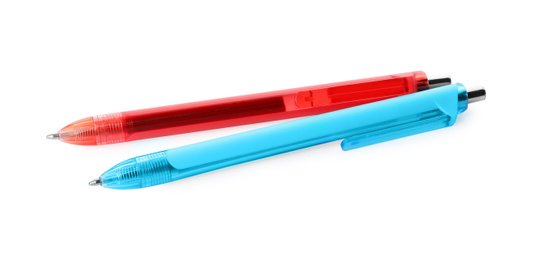 Photo of Red and blue retractable pens isolated on white