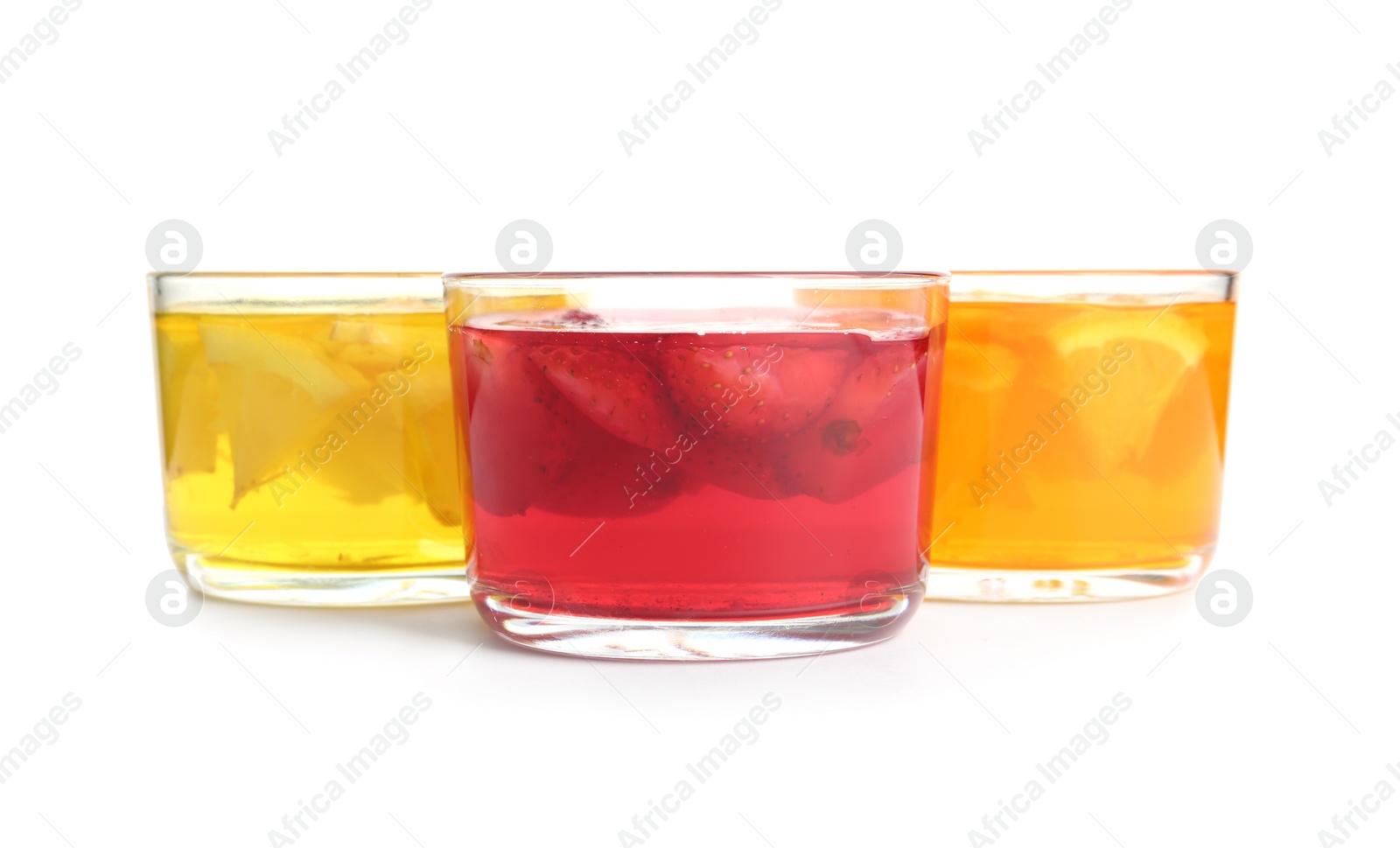 Photo of Tasty jelly desserts in glasses on white background