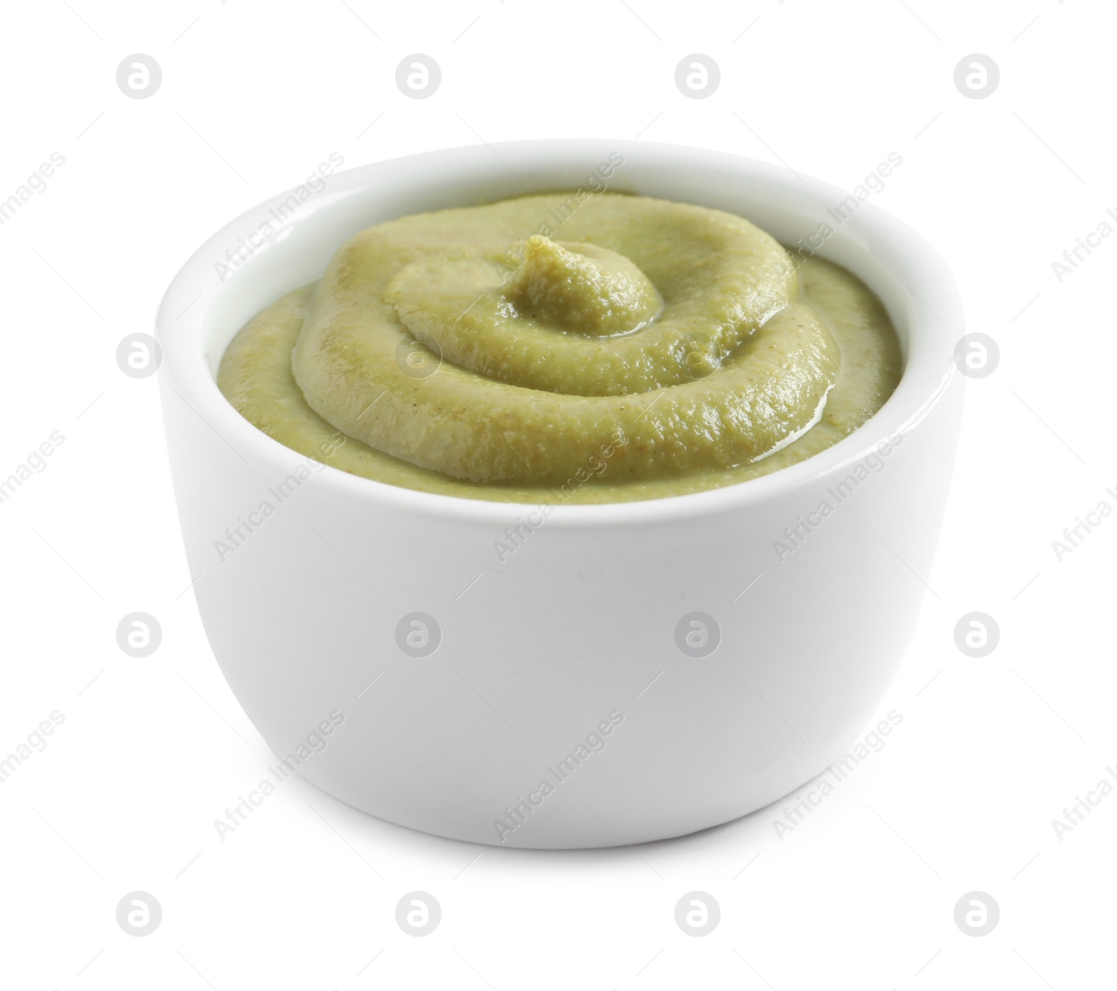 Photo of Delicious wasabi in bowl on white background. Spicy sauce