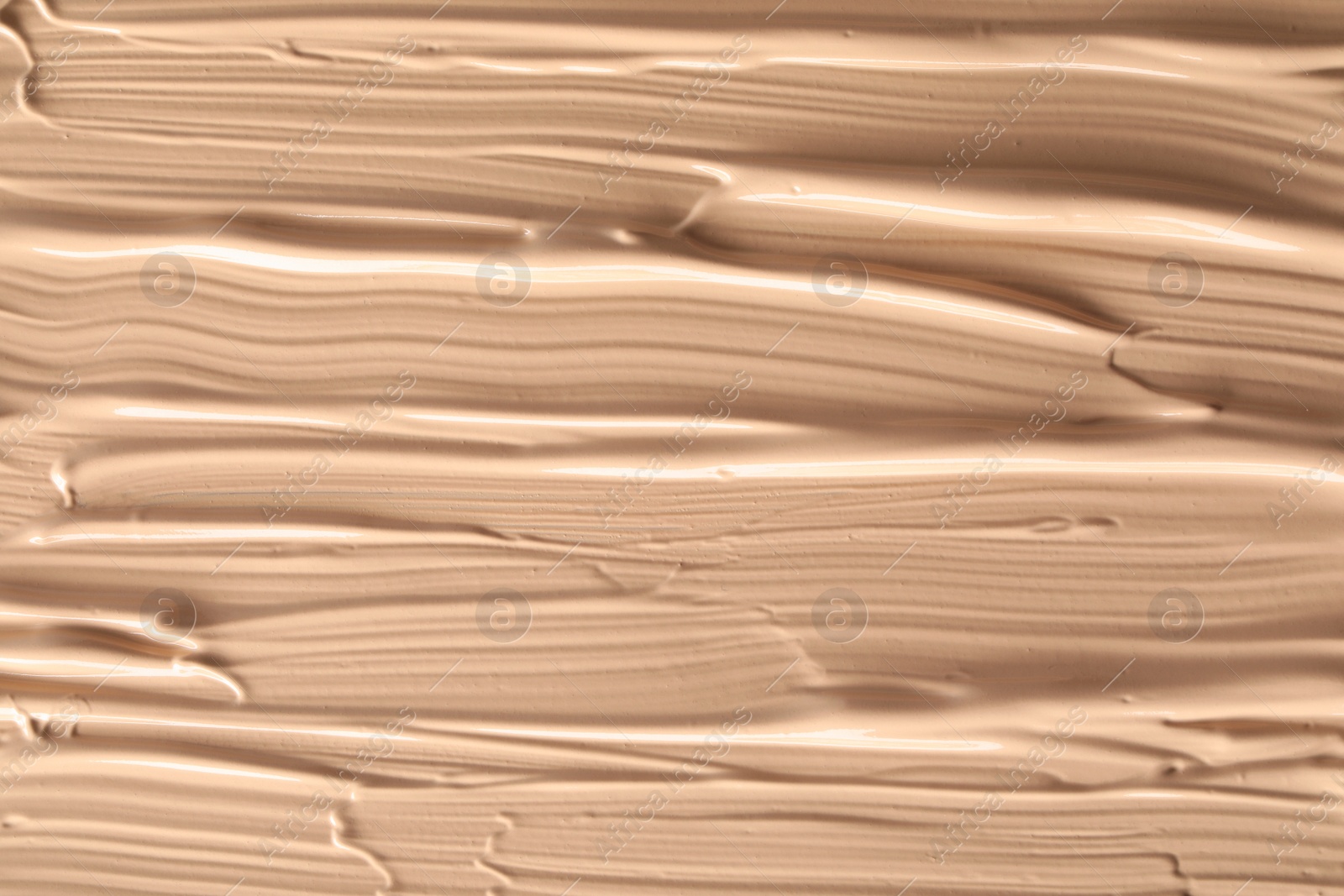 Photo of Texture of liquid skin foundation as background, closeup