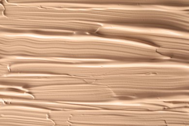 Photo of Texture of liquid skin foundation as background, closeup