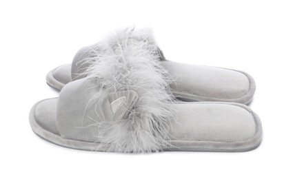 Pair of soft slippers with fur isolated on white