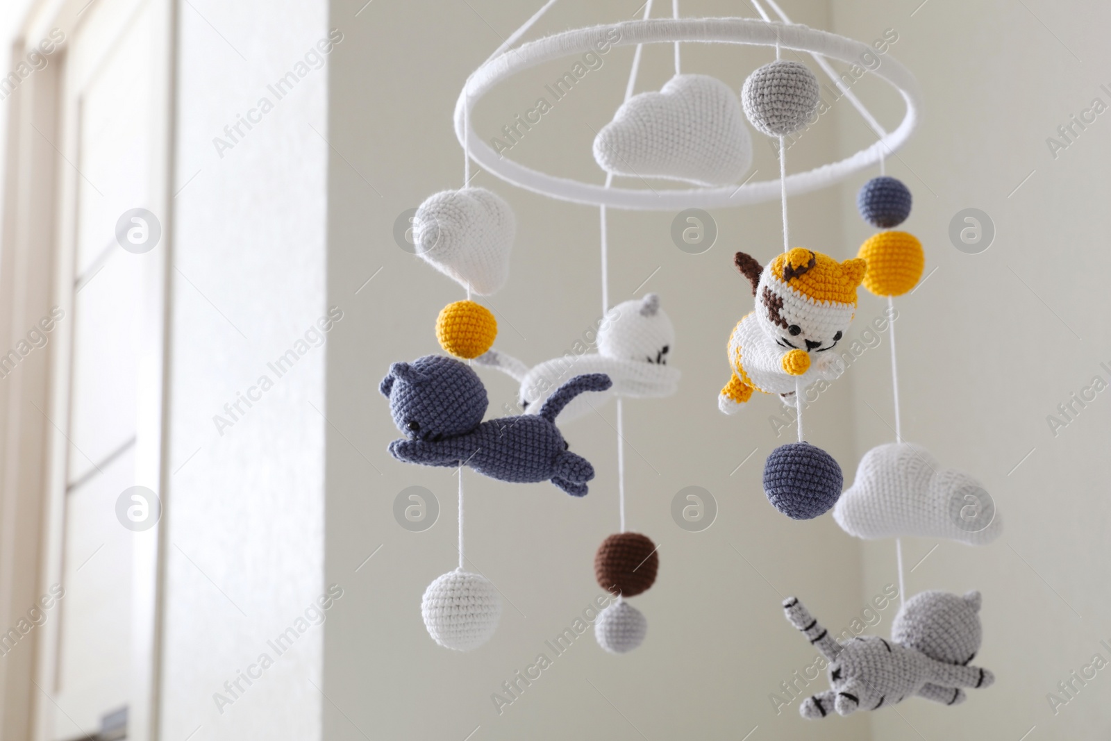 Modern baby crib mobile in children's room Photo of Modern baby crib mobile in children's room