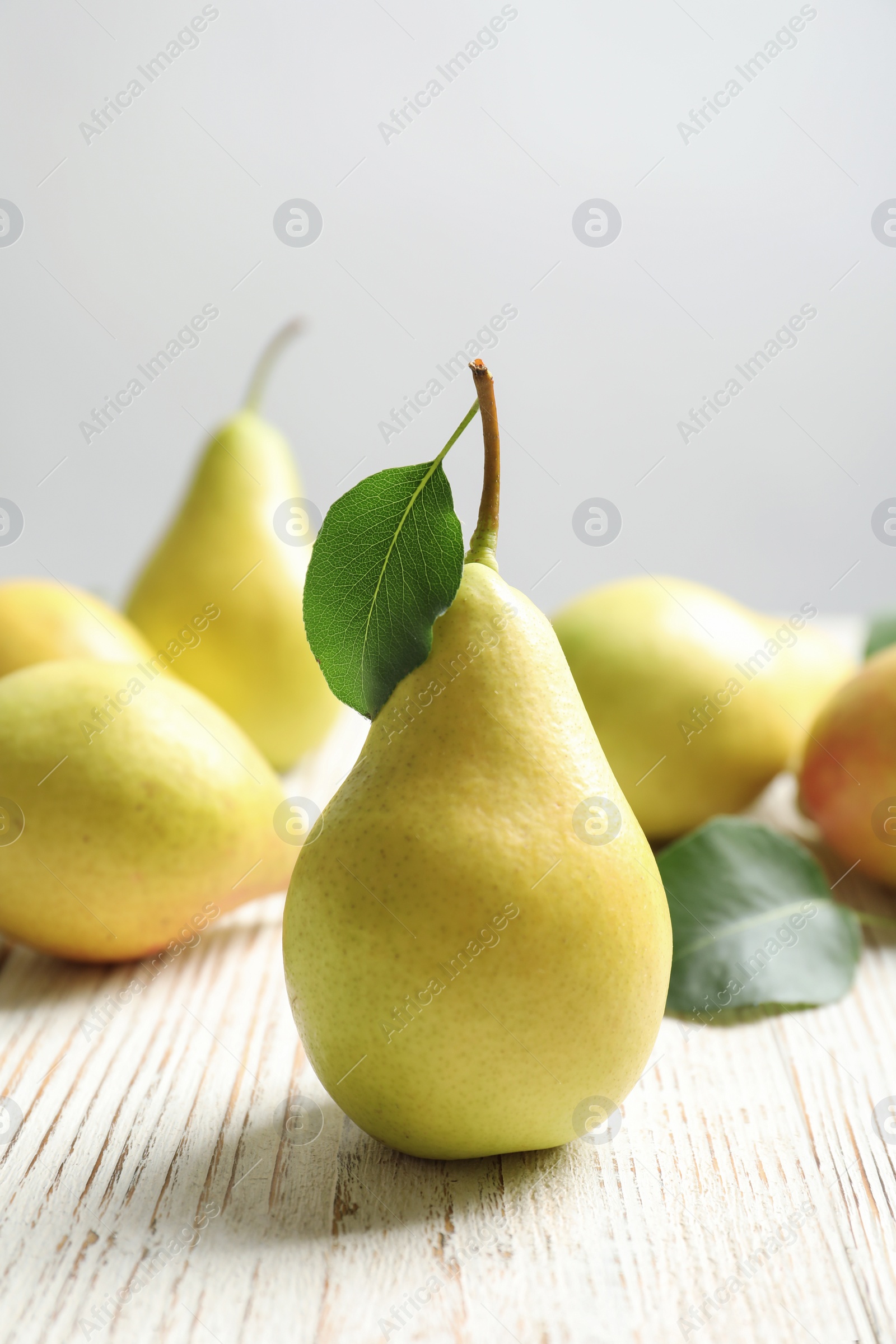 Photo of Ripe pears on wooden table. Healthy snack