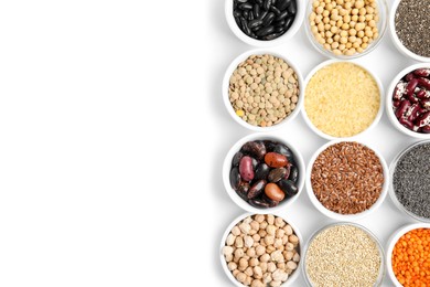 Various raw veggie seeds in bowls on white background, top view