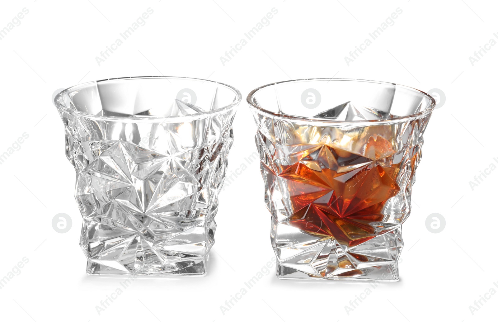 Photo of Empty and full whiskey glasses on white background