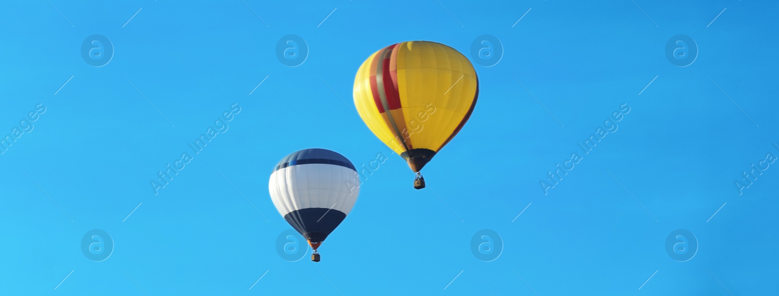 Image of Hot air balloons in blue sky. Banner design 