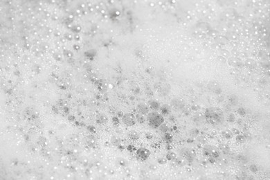 Photo of Texture of cleansing foam, closeup. Skin care cosmetic