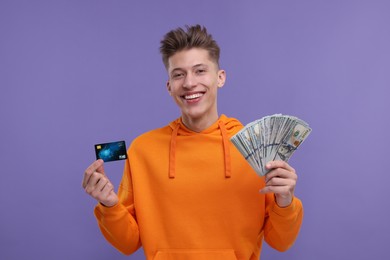 Photo of Happy man with money and credit card on purple background