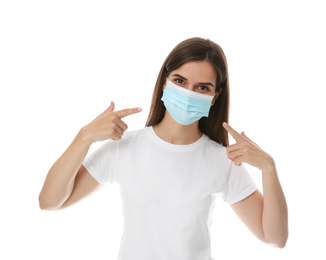 Photo of Female volunteer in mask on white background. Protective measures during coronavirus quarantine