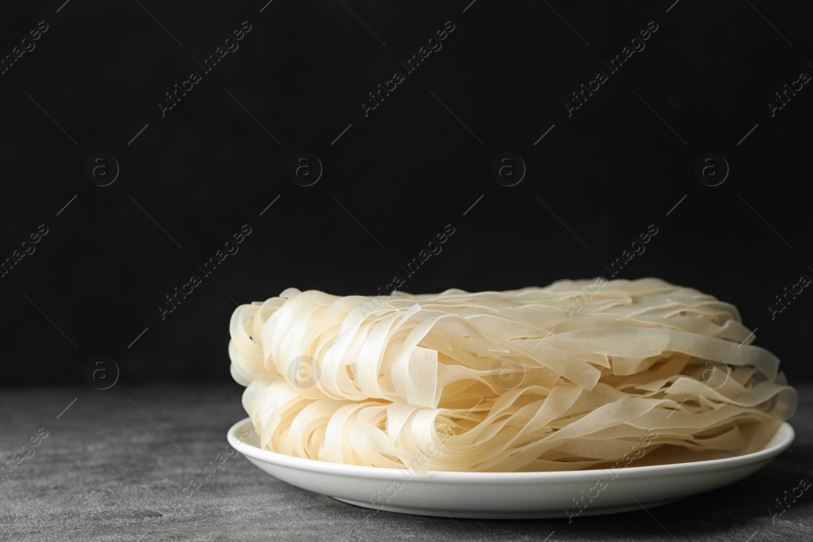 Photo of Block of rice noodles on grey table