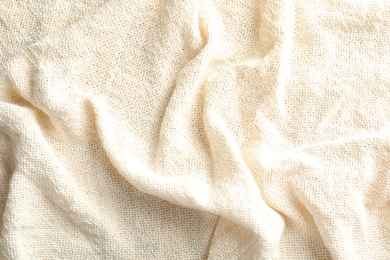 Closeup view of light natural hemp cloth. Fabric texture