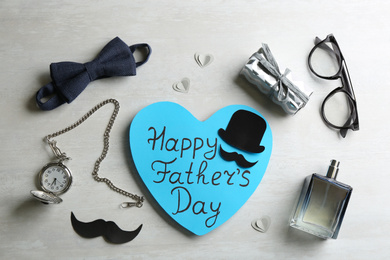 Photo of Flat lay composition with greeting card on white background. Happy Father's Day
