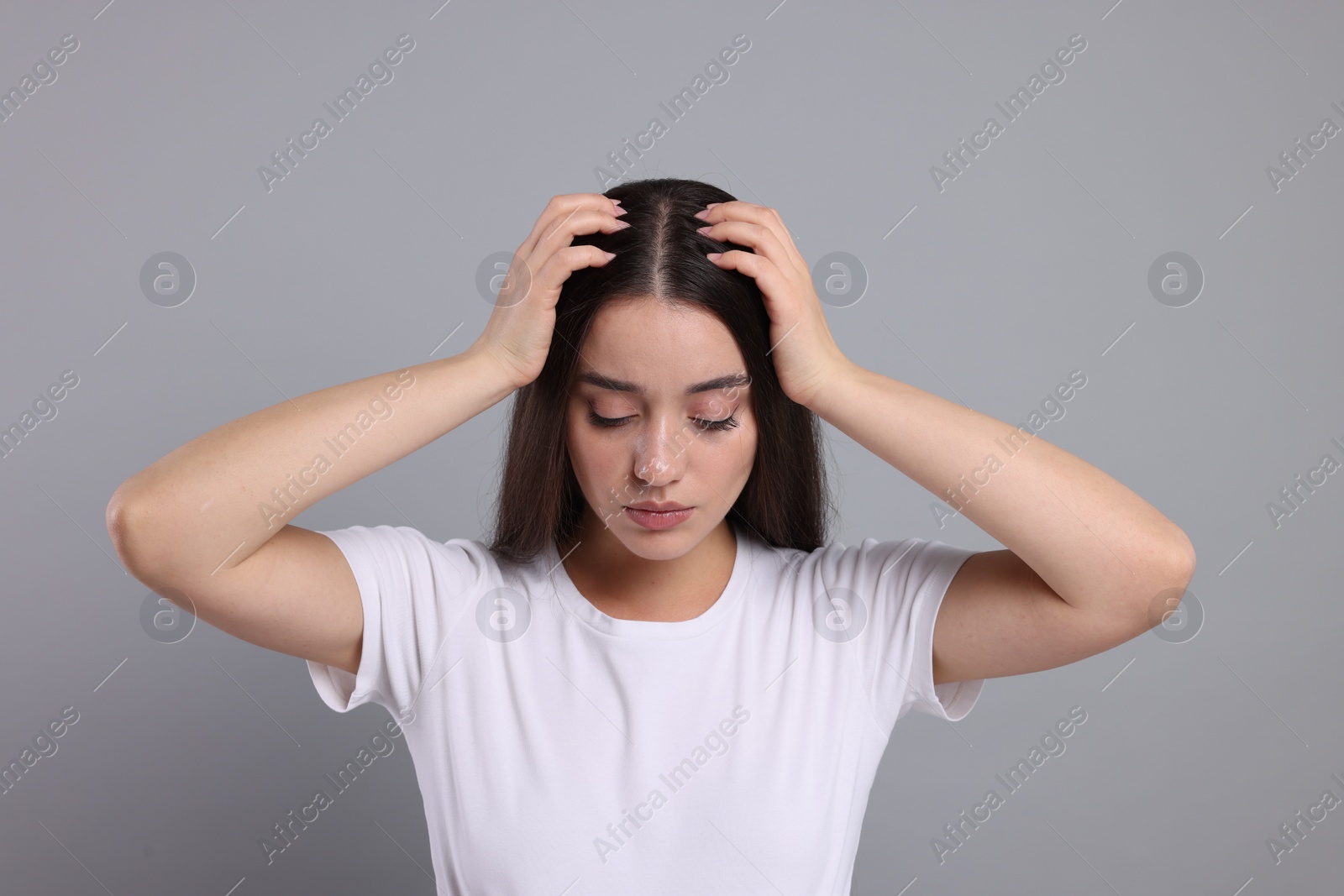 Photo of Woman with healthy hair on grey background