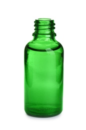 Photo of Little glass bottle with essential oil on white background