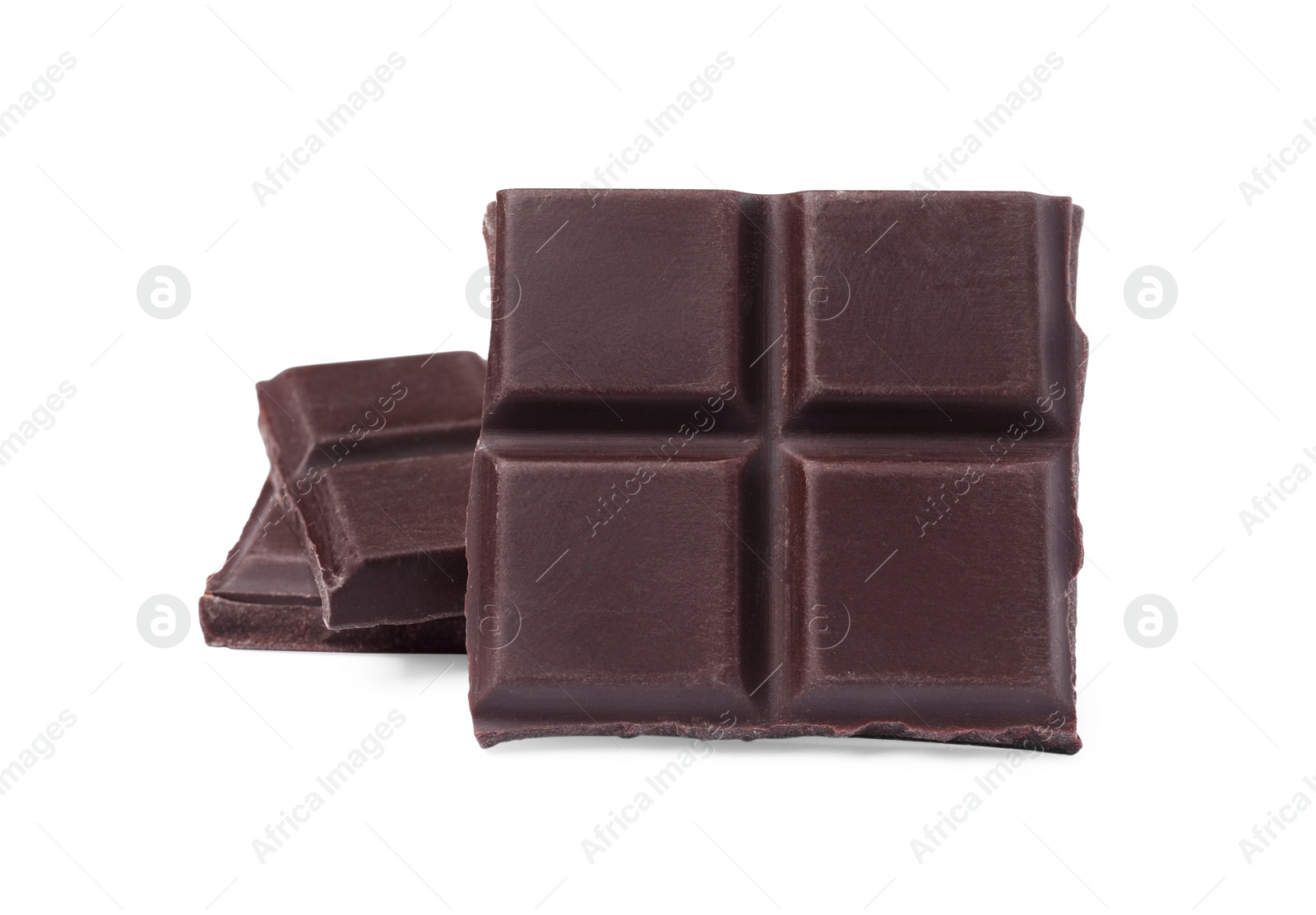 Photo of Pieces of delicious dark chocolate bar on white background